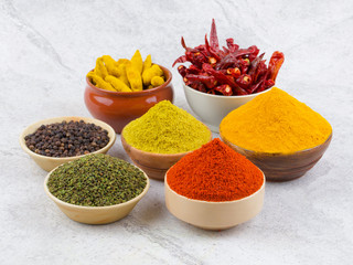 Indian Spices Collection Also Called Red Chili Powder, Turmeric Powder, Coriander Powder, Turmeric Stick, Dry Chili, Fenugreek, Black Pepper, Mirchi, Haldi, Dhaniya on Vintage Background