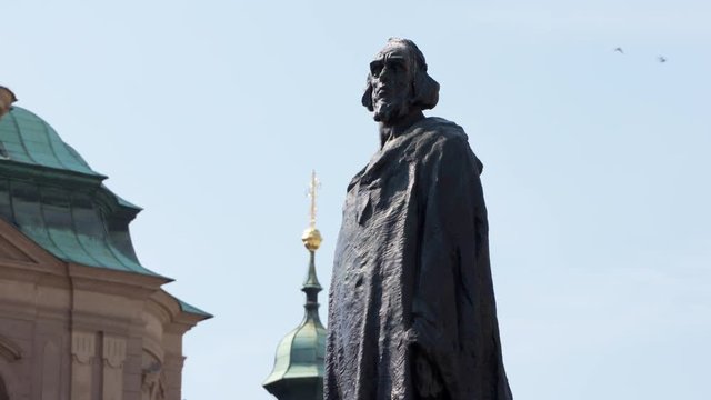 Medium shot of the Jan Hus Memorial in Old Town Square Prague.
