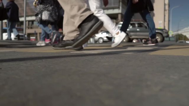 People walking on a pedestrian crossing. slow motion video.
