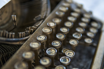 Close up view on an old dirty broken antique typewriter machine keys with Cyrillic symbols letters.