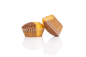 Group of two whole tasty fresh baked marble muffin isolated on white background