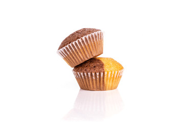 Group of two whole fresh baked marble muffin isolated on white background