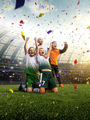 winning football player Children after score in a match confetti and tinsel