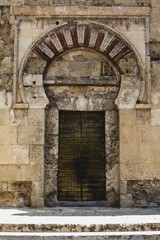 Fototapeta na wymiar Detail of the moorish entrance gate of Cordoba´s Great Mosque, Andalusia, Spain