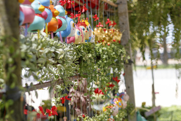 Hanging plant pots with green plants.