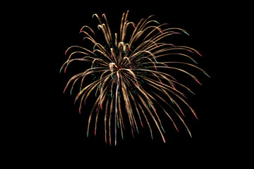 Colorful explosion fireworks isolated on black background at night sky.