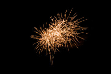 Colorful explosion fireworks isolated on black background at night sky.