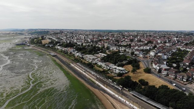 Aerial view of a C2C train aproaching the Chalkwell Station at noon.