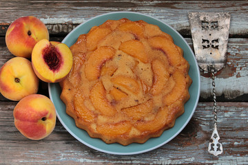 Peach pie on a wooden background
