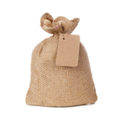 Canvas sack bag with blank label isolated on white background