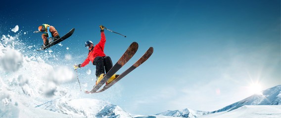 Skiing. Snowboarding. Extreme winter sports - obrazy, fototapety, plakaty