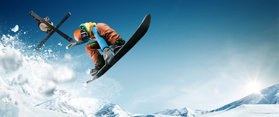 Skiing. Snowboarding. Extreme winter sports - obrazy, fototapety, plakaty