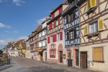 Fototapeta premium Quai de la Poissonnerie strret Half timbered houses at Quai de la Poissonnerie street, Little Venice Colmar, Alsace France.