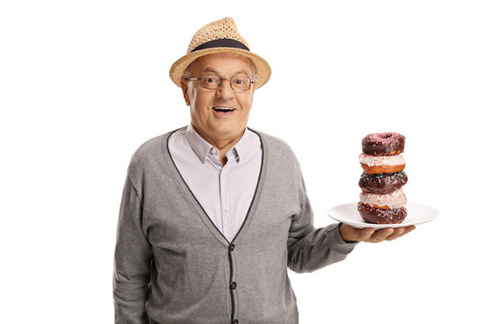 Mature man holding a plate of donuts