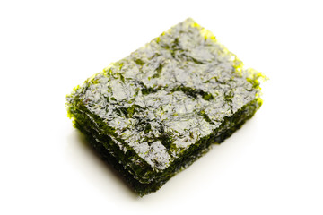 dried nori seaweed laminaria sheets, isolated on white © nikkytok