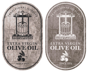 Set of vector labels for extra virgin olive oil with olive twig, oil press and barrel in retro style on wooden background