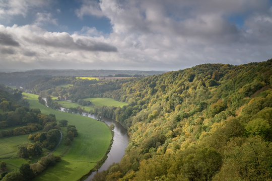 Beautiful autumn colored forest in Belgium with the Ourthe river