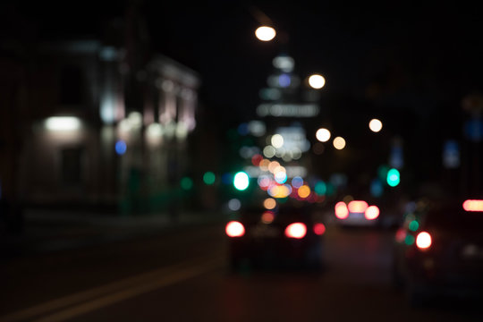 Texture of bokeh from traffic of light fires of the night city against a dark background. Motion blur