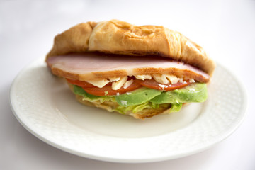 crossiant sandwich avocado, bacon, cheese, lettuce