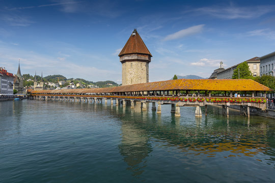 The famous Kapellbrucke (Chapel Bridge) wooden footbridge across the Reuss River in the city of Lucern, Switzerland.