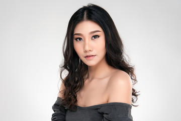 Naklejka premium Beautiful Young Asian Woman with Clean Fresh Skin
