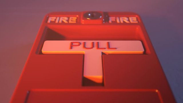 Fire alarm switch on a wall in a conflagration smoke. Button lit by fire flames.