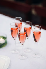 Rose Champagne glasses on a table