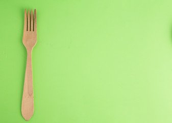 wooden fork in color background