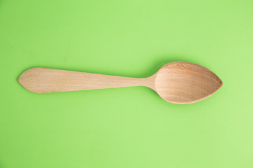 wooden spoon in color background