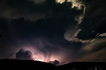 Lightning Behind the Mountain at night