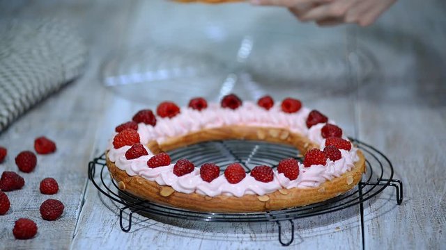Choux pastry eclair cake Paris Brest with raspberry.