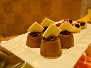 Dessert on the tray, waiting for guest to pick up in the buffet line