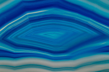 Macro mineral stone Blue Agate breed a white background