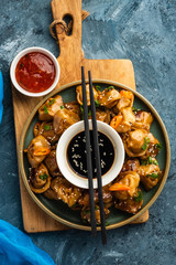 Fried dumplings with soy sauce with pepper and green onions. Asian cuisine