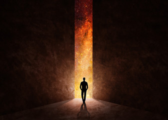 Man in front of open door with universe behind
