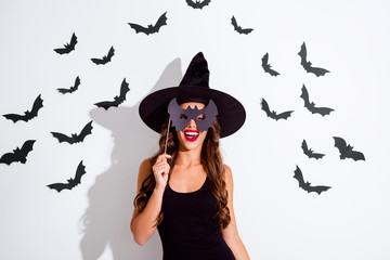 Trick or threat Close up portrait of cheerful woman with curly 