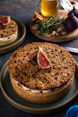 Tarte on sand base with fresh figs, almonds and crispy waffle with almonds and cocoa powder. Fresh Homemade Fruit Tart with berries