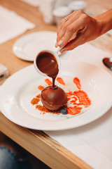 Gluten-free vegan chocolate muffins with beetroot, almond powder, buckwheat flour and karob or cocoa . Chocolate pouring cupcake. Homemade cupcakes on gray concrete background with copyspace.