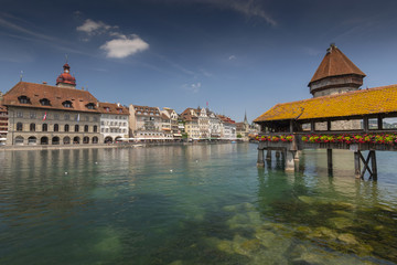 View of the old town with Town Hall and Chapel Bridge, wooden footbridge across the Reuss River in...