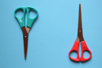 variations of layouts of stationery items, scissors on a colored background