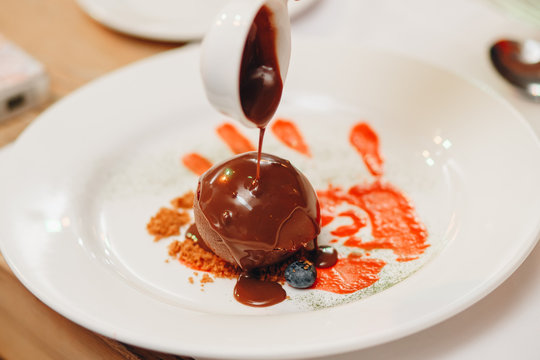 Gluten-free vegan chocolate muffins with beetroot, almond powder, buckwheat flour and karob or cocoa . Chocolate pouring cupcake. Homemade cupcakes on gray concrete background with copyspace.