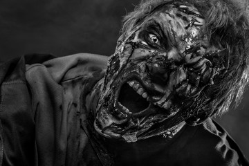 Fototapeta premium Close-up portrait of a horrible scary zombie man. Horror. Halloween 2018