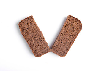 Two slices of black bread isolated on white background close-up