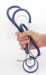 hand of a young person is holding on a stethoscope isolated