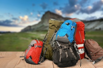 Tourists backpacks for leisure activities on background