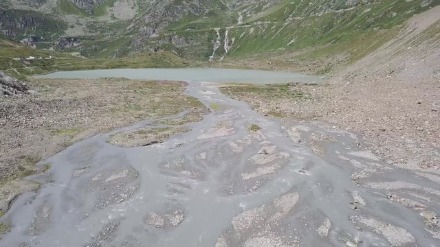 Flight towards the mountain lake at the Steingletscher (Switzerland)