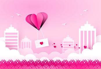 Love and valentine day. Heart air balloon carries love letter over city