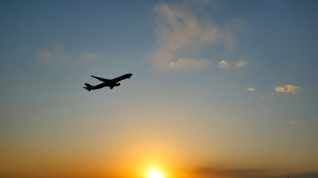 Plane Taking Off Sky Sunset Sun Dusk In Airport China. Beijing.