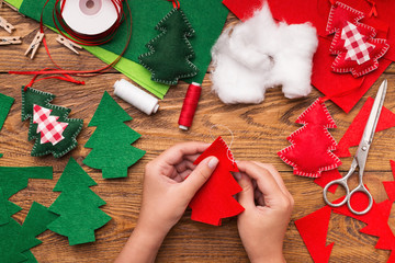 Making of handmade christmas toys from felt