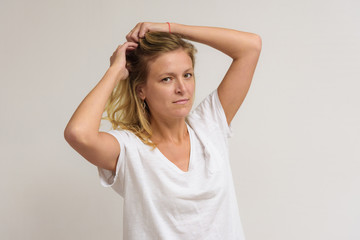 Fototapeta premium Portrait of a beautiful girl on a white background.